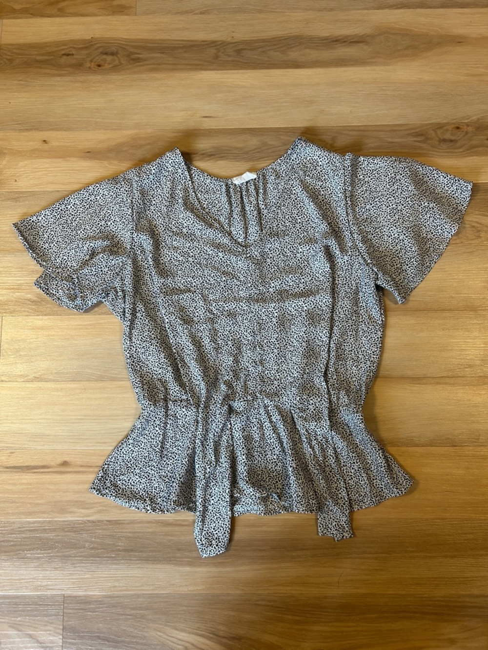 Sienna Sky Beige and Black Animal Print Peplum Blouse